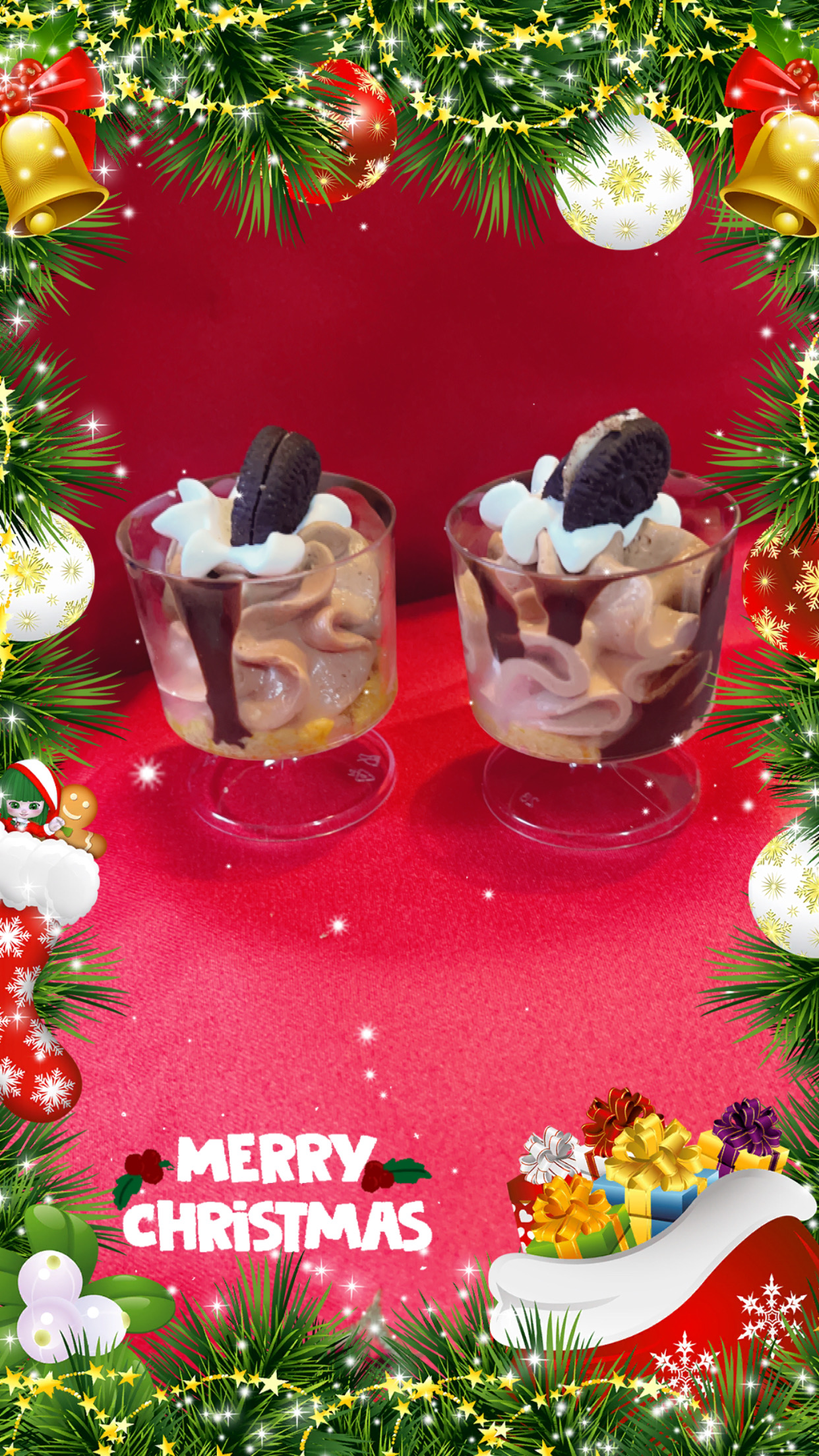 Chocolate mousse cups topped with whipped cream and an Oreo cookie, holiday themed